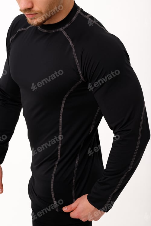 Preview: A man with a sporty physique in thermal underwear.