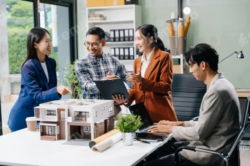 Preview: Asian architects and designers brainstorming and collaborating in a modern office