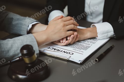 Preview: Lawyers holding business woman hand while consult at lawyer office. Law, legal services, advice
