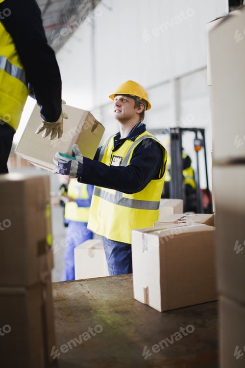 Preview: Workers unloading boxes from truck