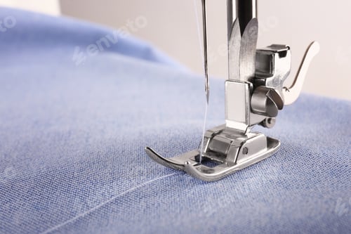 Preview: Closeup view of sewing machine with fabric