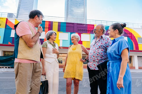 Preview: Group of senior friends meeting outddors in the city and having fun
