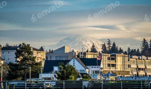 Preview: A View Of Buildings In Des Moines, Washington With Mount Rainier Behind.