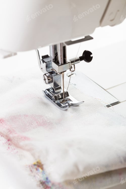 Preview: Sewing machine in action stitching fabric together at daytime craft session