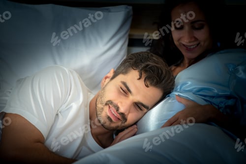 Preview: Pregnant woman with husband in bedroom with the atmosphere of having fun talking