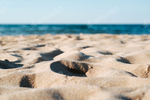 Preview: Close-up beach sunny summer day, yellow sand and sea low angle view