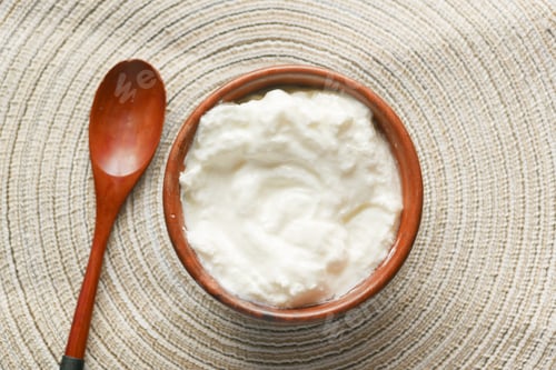 Preview: fresh yogurt in a bowl on table