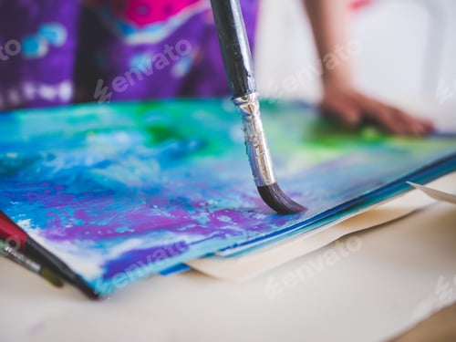 Preview: Close up on hand painting with brush