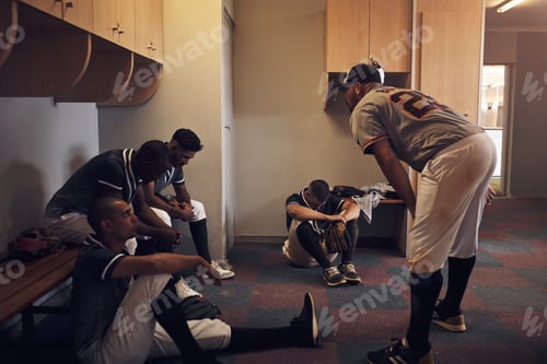 Preview: Shot of a young man yelling at his fellow baseball players in a locker room