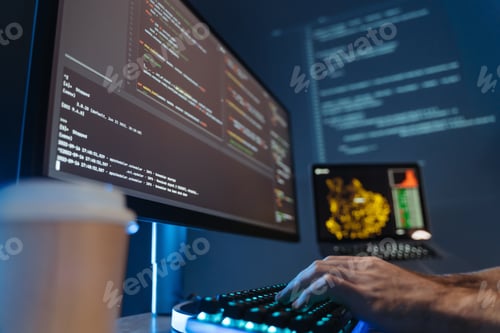 Preview: No face picture of software engineer hands typing and composing app script in front of pc screen