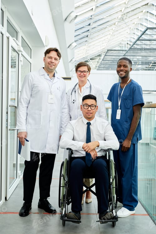 Preview: Person in Wheelchair with Group of Doctors
