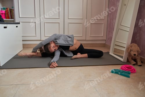 Preview: Girl Does Splits Stretch on Yoga Mat Indoors