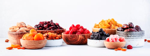 Preview: Dried fruits and nuts in bowls set. Dry apricots, figs, raisins, walnuts, almonds and other
