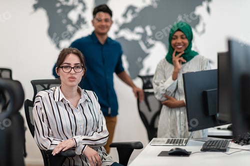Preview: Multiethnic startup business team woman wearing a hijab on meeting in modern open plan office
