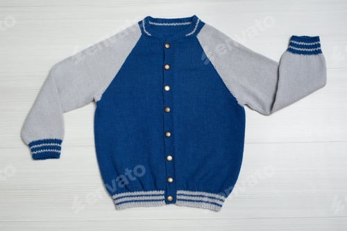Preview: Knitted children's sweater on a white background