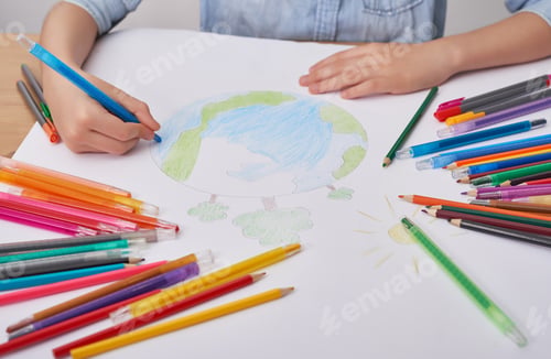 Preview: Child boy draws planet for earth day. Protection of enviroment, Mother Earth Day. Save our planet