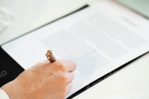 Preview: Closeup person signs a contract on cooperation