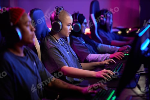 Preview: Multiethnic Group of Women Playing Video Games in Row as eSports Team