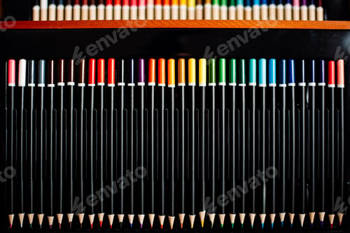 Preview: Color pencils for artistic drawing ordered by color gradient, on black background