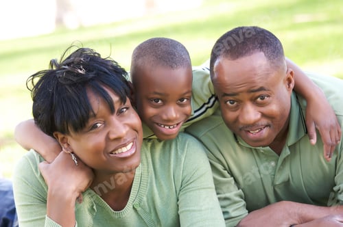 Preview: Family Portrait with Smiling Boy and Parents Outdoors