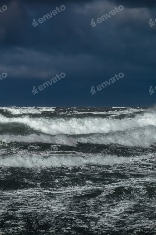 Preview: Heavy storm at the gates to the port of Klaipeda, Lithuania. Baltic Sea against a gray cloudy sky