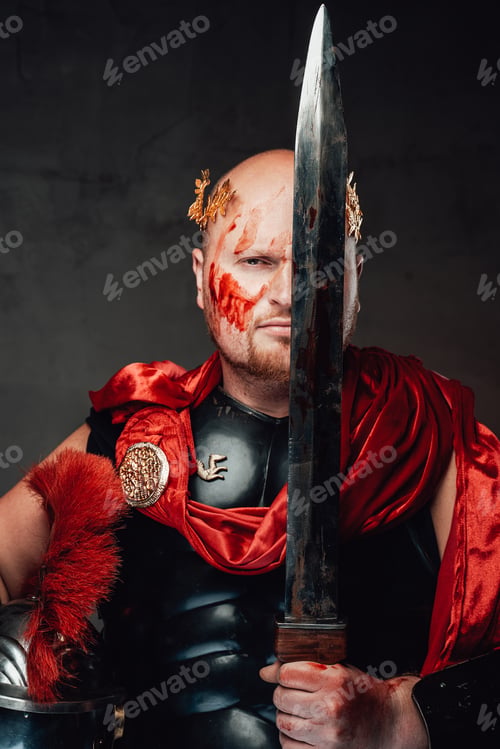 Preview: Roman guardian poses with sword near his face in dark background