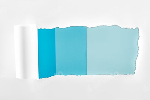 Preview: tattered textured white paper with rolled edge on blue background