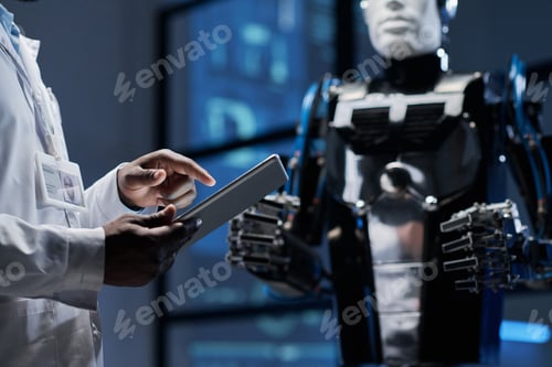 Preview: Engineer connecting robot with digital tablet