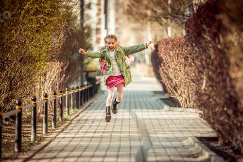 Preview: happy little girl running from school