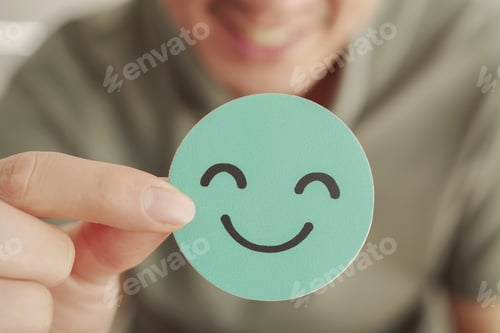 Preview: Hand holding green happy smile face paper cut, good feedback rating ,mental health assessment,