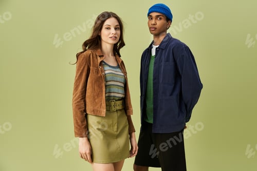 Preview: Young couple showcases vibrant autumn fashion with fresh styles and rich colors in urban setting