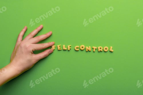 Preview: self controt concept, person making words of cookies isolated on green. healthy lifestyle and