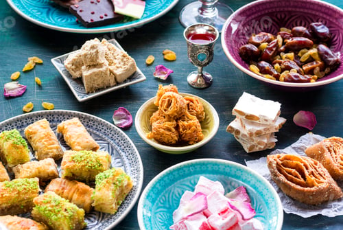 Selection of Middle Eastern Candies on Colorful Plates