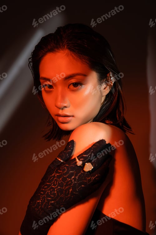 Preview: portrait of charming asian woman with short hair and wet hairstyle posing in black glove