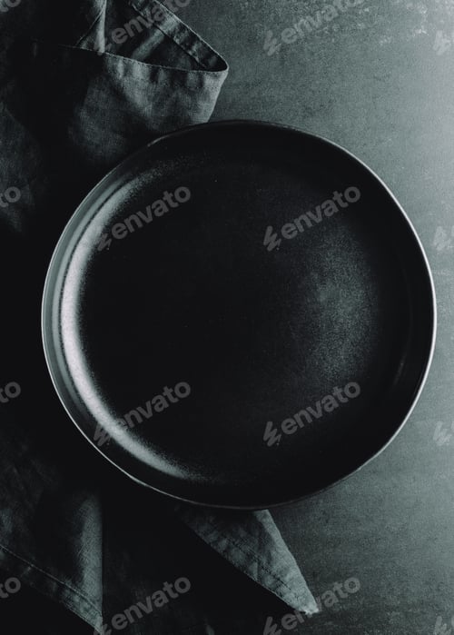 Preview: Top down view on an empty ceramic black plate