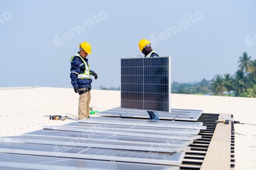 Preview: workers installing solar panels, for efficient energy on rooftop