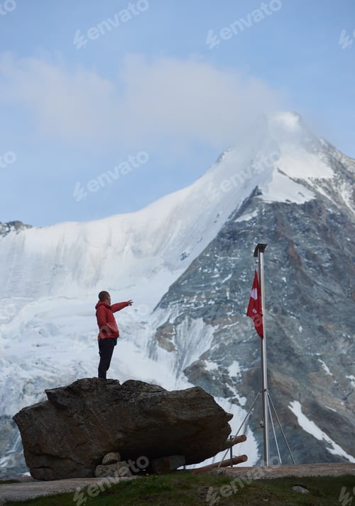 Preview: Tourist standing on huge stone mountains scenery.