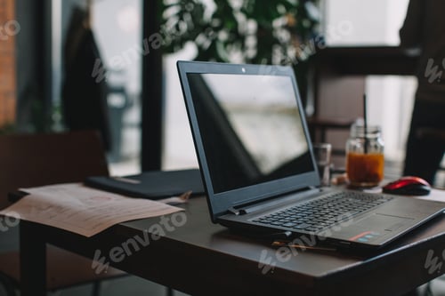 Preview: Working in cafe. Laptop, documents, tea.