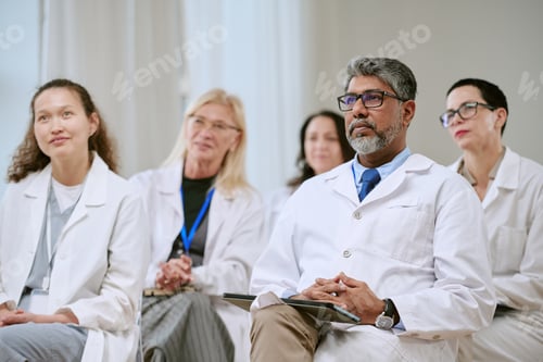 Preview: Diverse Group of Middle Aged Medical Professionals Attending Seminar