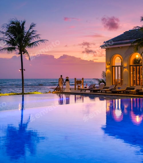 Preview: young couple men and women at the swimming pool during vacation at the tropical island in Thailand