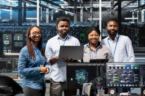 Preview: Portrait of smiling data center specialists using machine learning algorithms