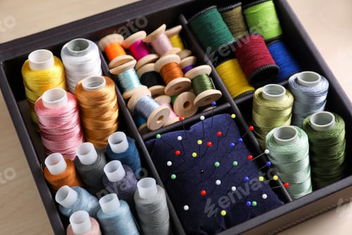 Preview: Set of sewing threads and cushion with pins in organizer, closeup