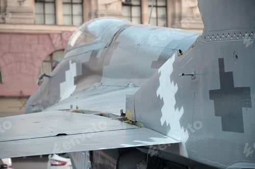 Preview: Old fighter aircraft painted in grey camouflage shapes with many