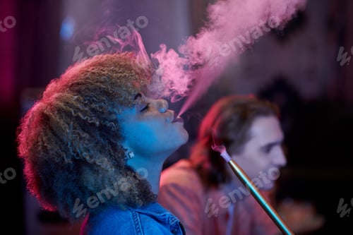 Preview: Young Woman Exhaling Smoke
