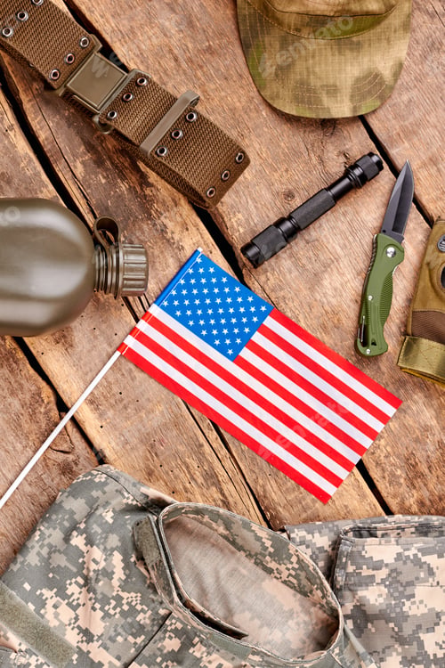 Preview: Set of us soldier equipment on wooden table