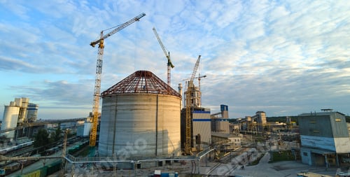Preview: Aerial view of cement factory under construction with high concrete plant structure