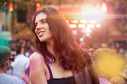 Preview: Woman looking away in festive park