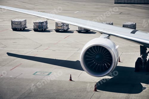 Preview: Loading of cargo containers to plane at airport