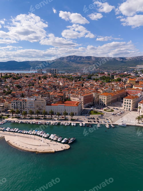 Preview: Aerial view of Split, Croatia with its historic architecture, marina, and distant mountains
