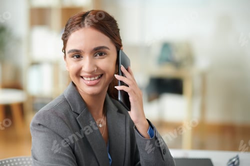 Preview: Young Businesswoman Talking on Phone